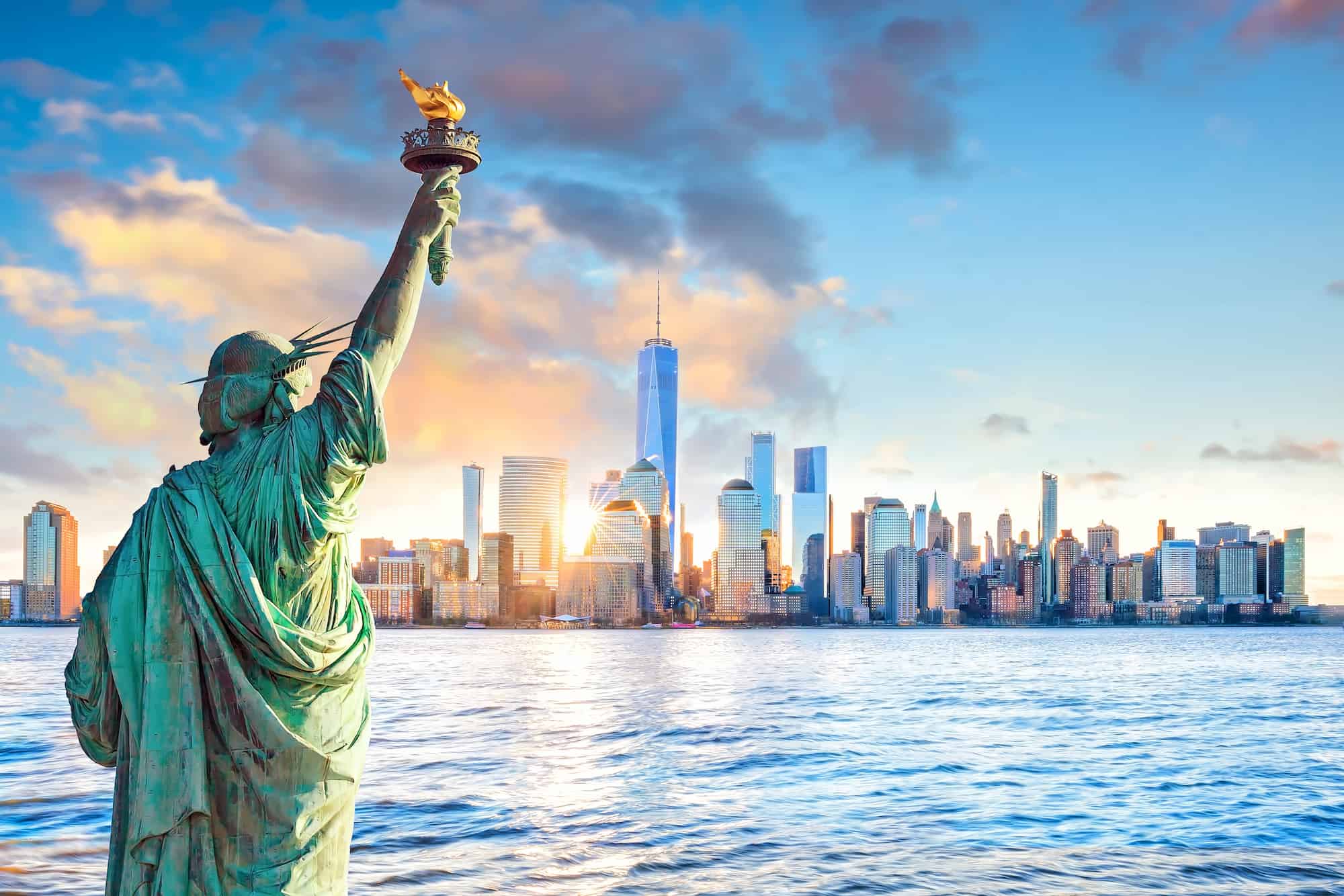 statue-liberty-new-york-city-skyline-sunset-united-states